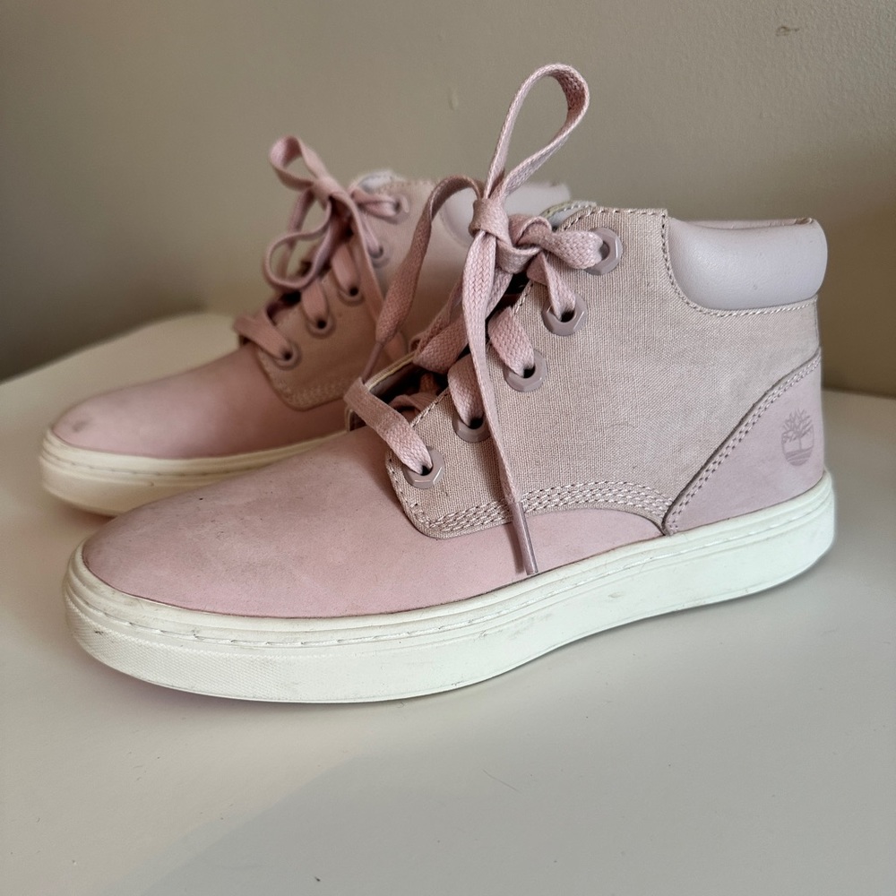 Pink Timberland lace up boots.